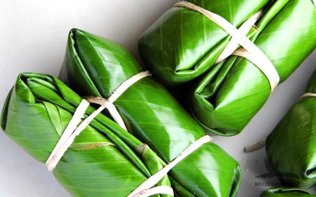 Belizean Conkies Wrapped in Banana Leaf Ready to Steam - Conkies Recipe