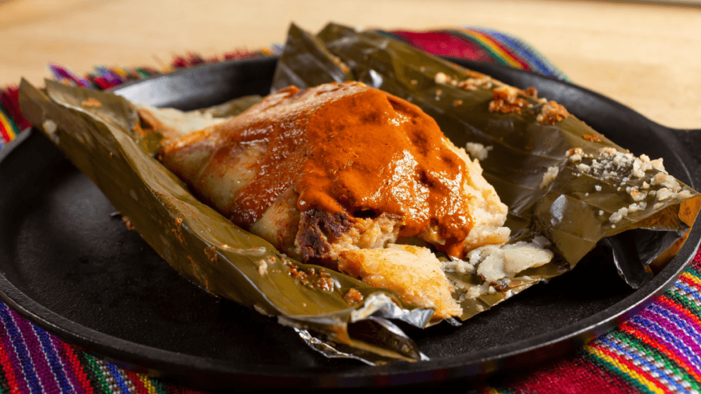 Belizean Tamales are wrapped in a banana leaf and steamed until cooked.
