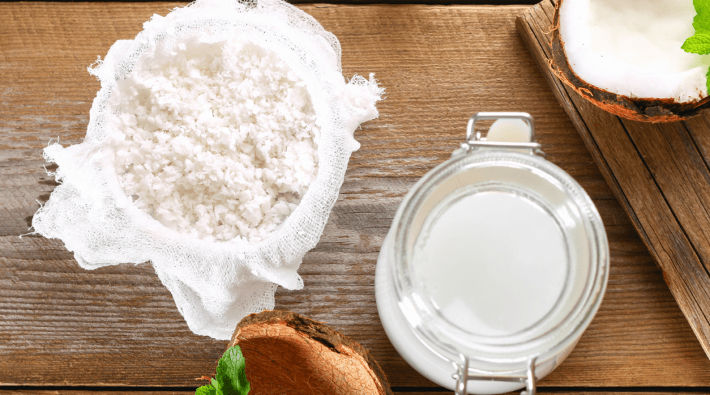 Extracting coconut milk from freshly grated coconut for use in Belize cooking.
