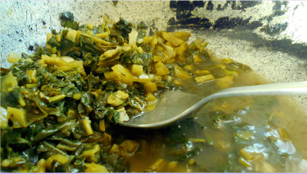 Simmering Callaloo Soup Recipe - Cooking the Callaloo before adding remaining ingredients. 