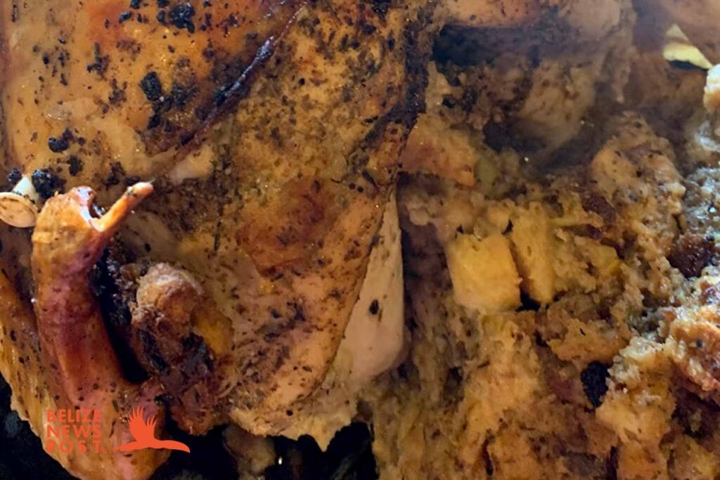 Stuffing coming out of fully cooked Belizean Turkey 