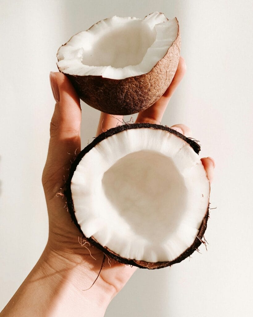 Freshly cracked coconut ready to harvest coconut meat and milk.